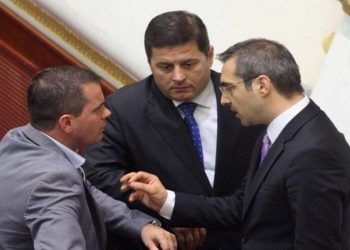 Armando Prenga with MP Pjerin Ndreu and Interior Minister Saimir Tahiri in Parliament